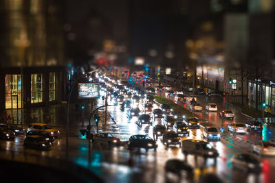 Tilt-shift image of vehicles moving on road