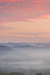 Scenic view of landscape against sky at sunset