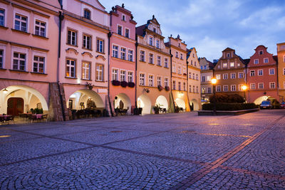 Buildings in city at dusk