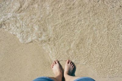 Low section of woman on beach