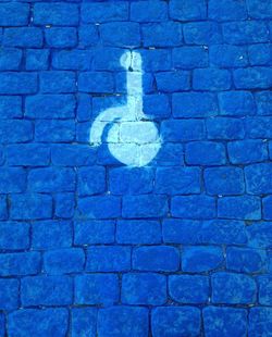 High angle view of arrow symbol on road