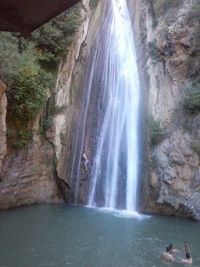 Scenic view of waterfall in forest