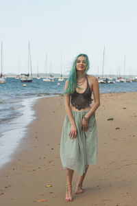 Portrait of smiling young woman on beach