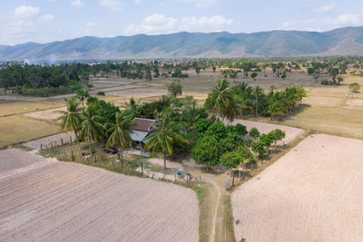 Panoramic view of agricultural field against sky