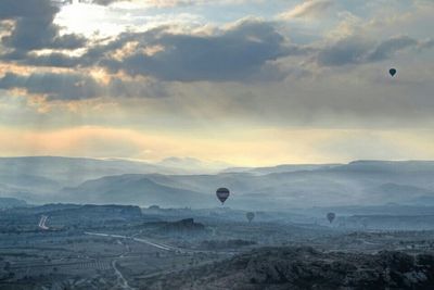 Scenic view of landscape against cloudy sky