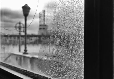 Close-up of raindrops on glass window