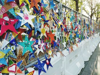 Multi colored umbrellas hanging on railing