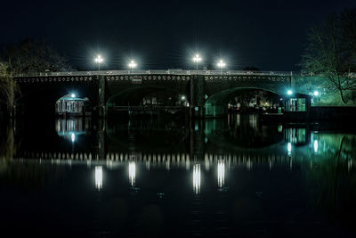 Illuminated bridge at night