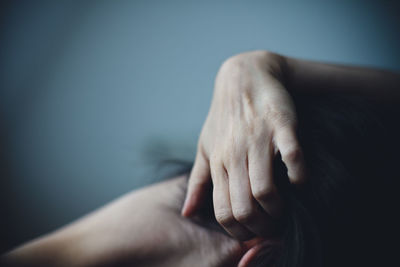 Cropped image of woman with hand in hair