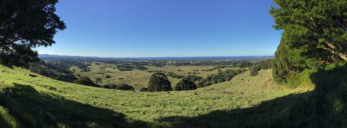 Scenic view of landscape against clear blue sky