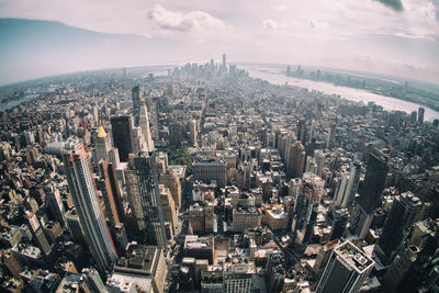 High angle view of modern buildings in city against sky