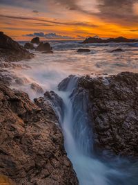 Scenic view of sea against sky during sunset