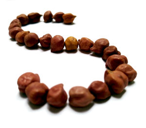 Close-up of coffee beans against white background