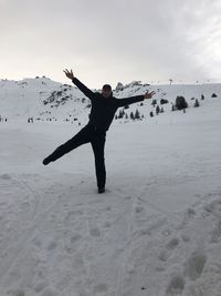 Full length of person on snow covered land