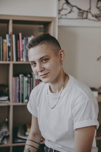 Portrait of young man at home