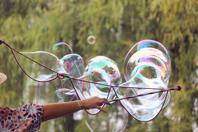 Close-up of hand holding bubbles