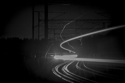 Low angle view of light trails at night