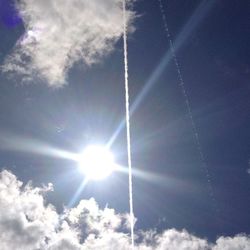 Low angle view of vapor trails in sky