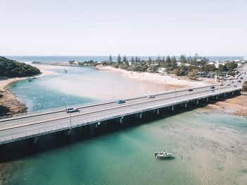 High angle view of bridge over sea against clear sky