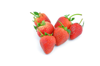 Close-up of strawberry over white background