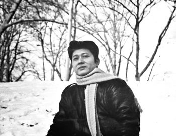Woman standing on snow covered landscape