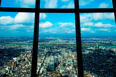 High angle view of cityscape seen through window