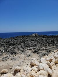 Scenic view of sea against clear blue sky