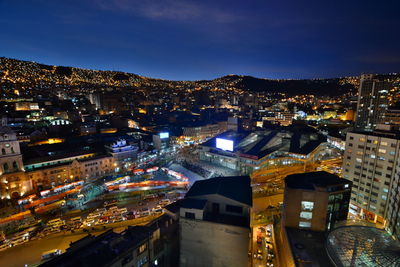 Aerial view of illuminated city at night