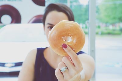 Close-up of woman holding ice cream cone