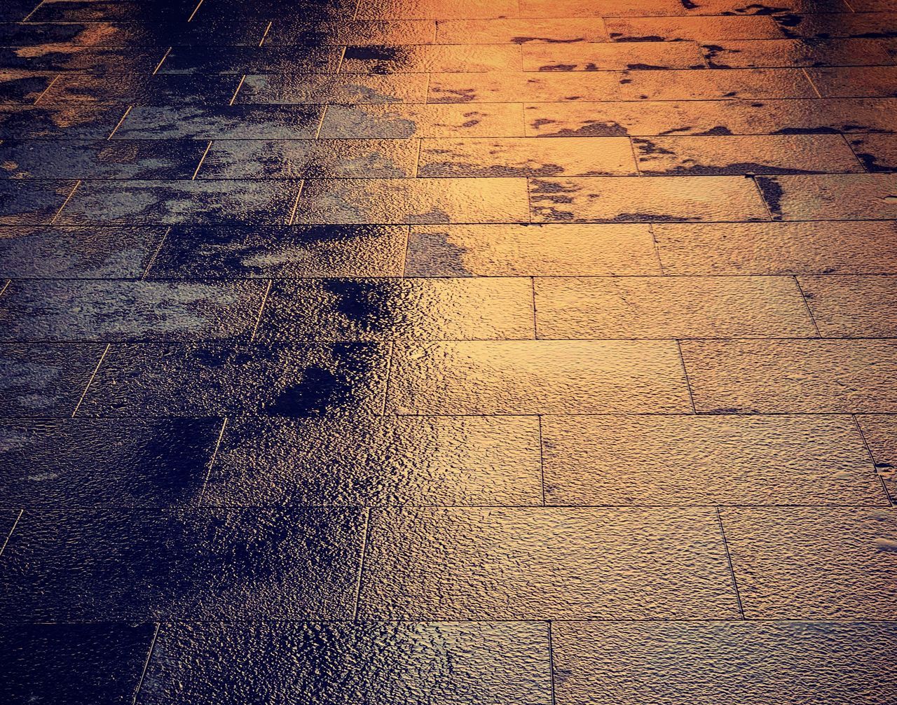 HIGH ANGLE VIEW OF SHADOW ON STREET