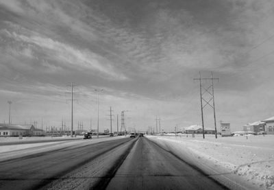 View of road against cloudy sky