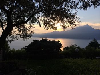Scenic view of lake at sunset