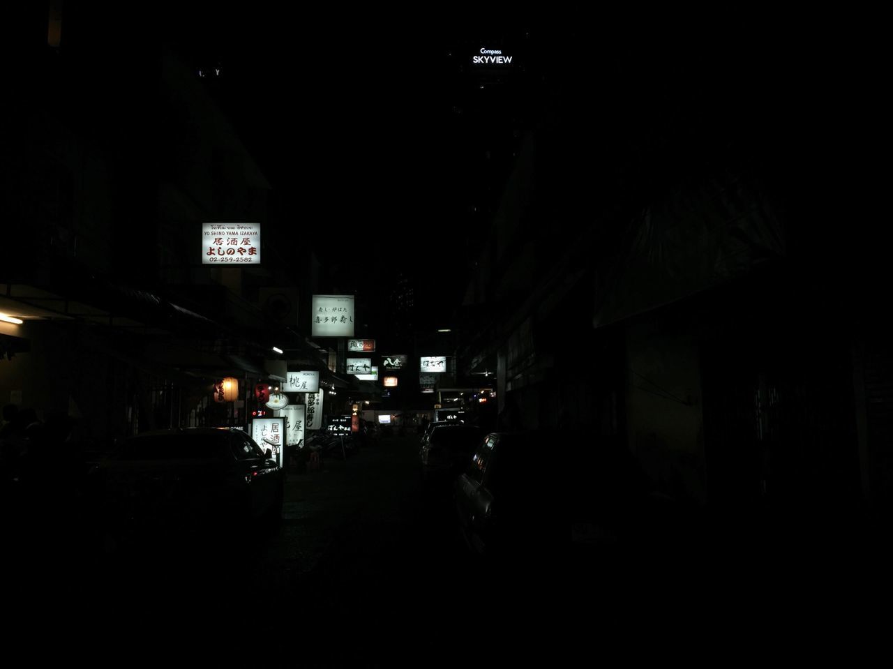 Illuminated store sign at night