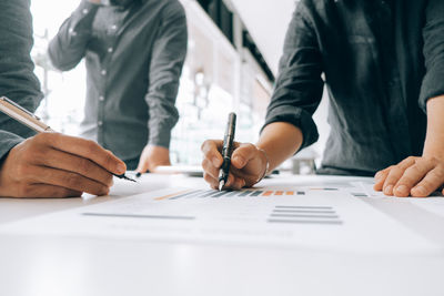 Group of people working in pen