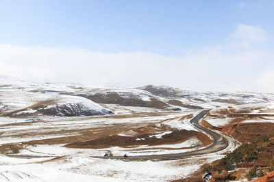 Scenic view of landscape against sky during winter