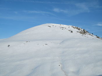 Scenic view of snowcapped mountain against sky