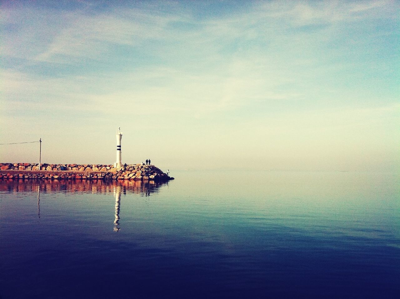 water, waterfront, sea, sky, tranquility, tranquil scene, scenics, rippled, nature, nautical vessel, beauty in nature, cloud - sky, horizon over water, reflection, pier, cloud, idyllic, outdoors, boat, calm