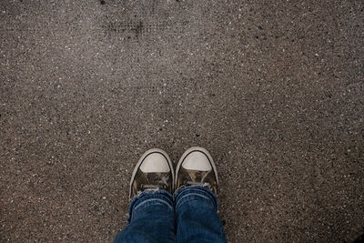 Low section of person standing on street