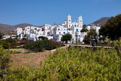 Buildings against clear blue sky