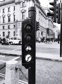 Close-up of information sign on street in city