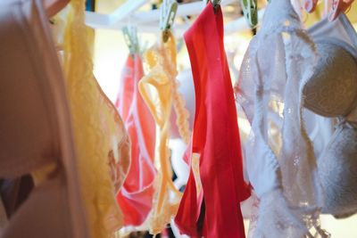 Low angle view of clothes hanging in store