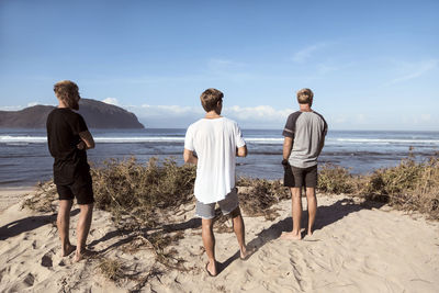 Young people at the beach at sunny day