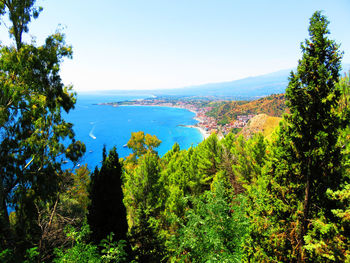 Scenic view of sea against clear blue sky