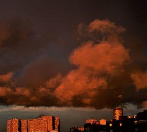 Low angle view of smoke emitting from chimney against sky