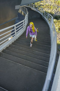 High angle view of woman on staircase