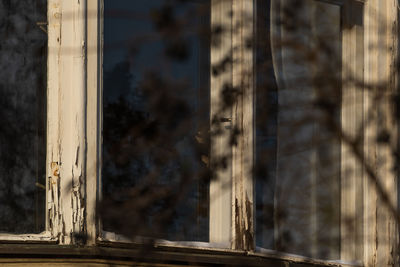 Close-up of window of abandoned building