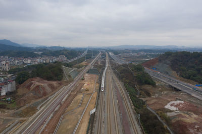 High angle view of railroad tracks in city against sky