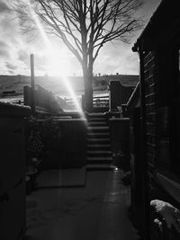 Footpath amidst buildings against sky