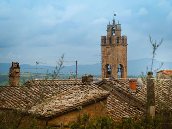 High angle view of bell tower and roof tiles in montepulciano, tuscany 
