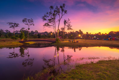 Scenic view of lake against sky during sunset